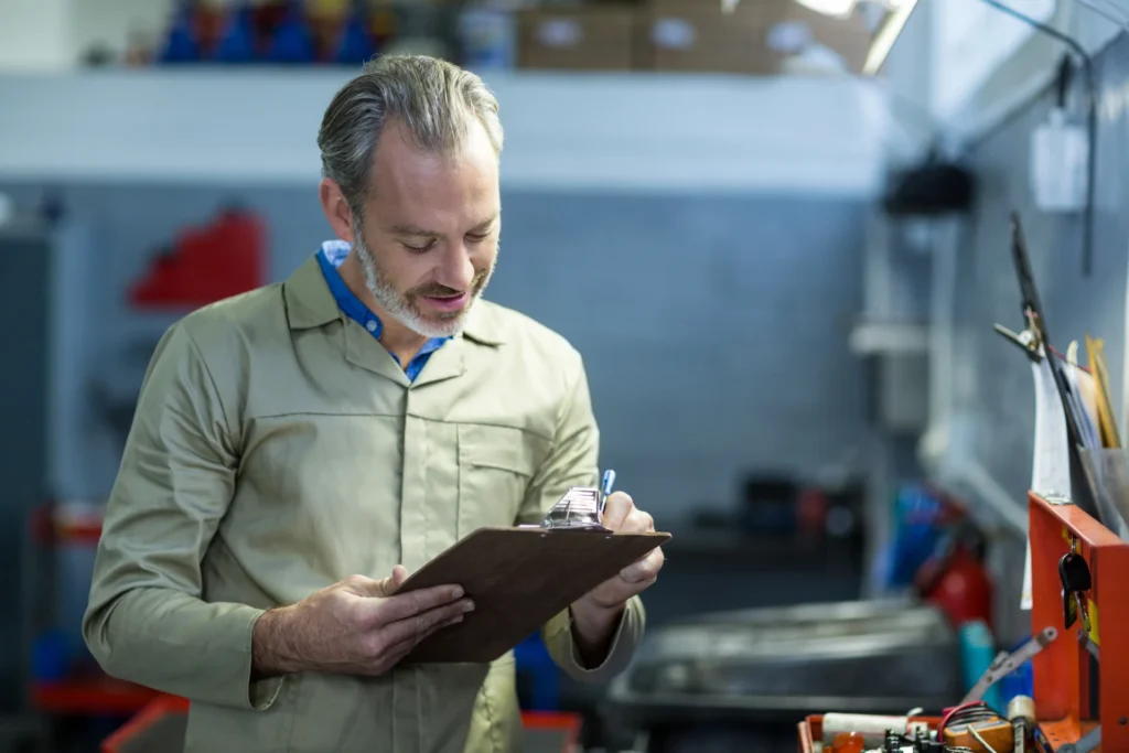 Product life cycle analysis (LCA) - before you start calculating, define the goal and boundaries (photo of a mechanic checking data)