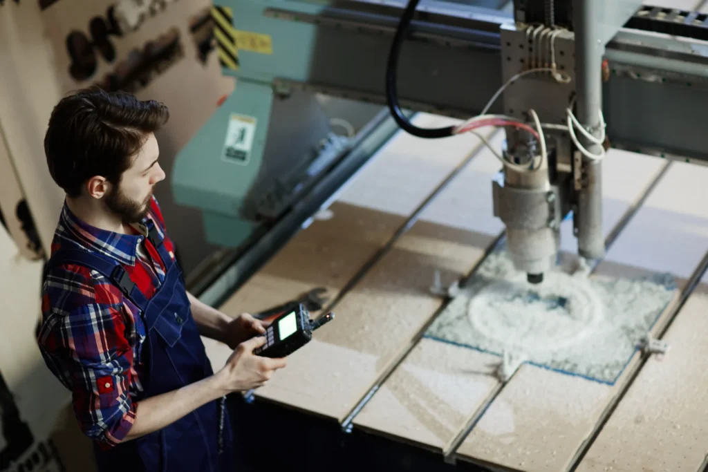Ceramic manufacturing digitalization - the challenge was integrating machines from different manufacturers and generations (photo of an engineer beside a machine)